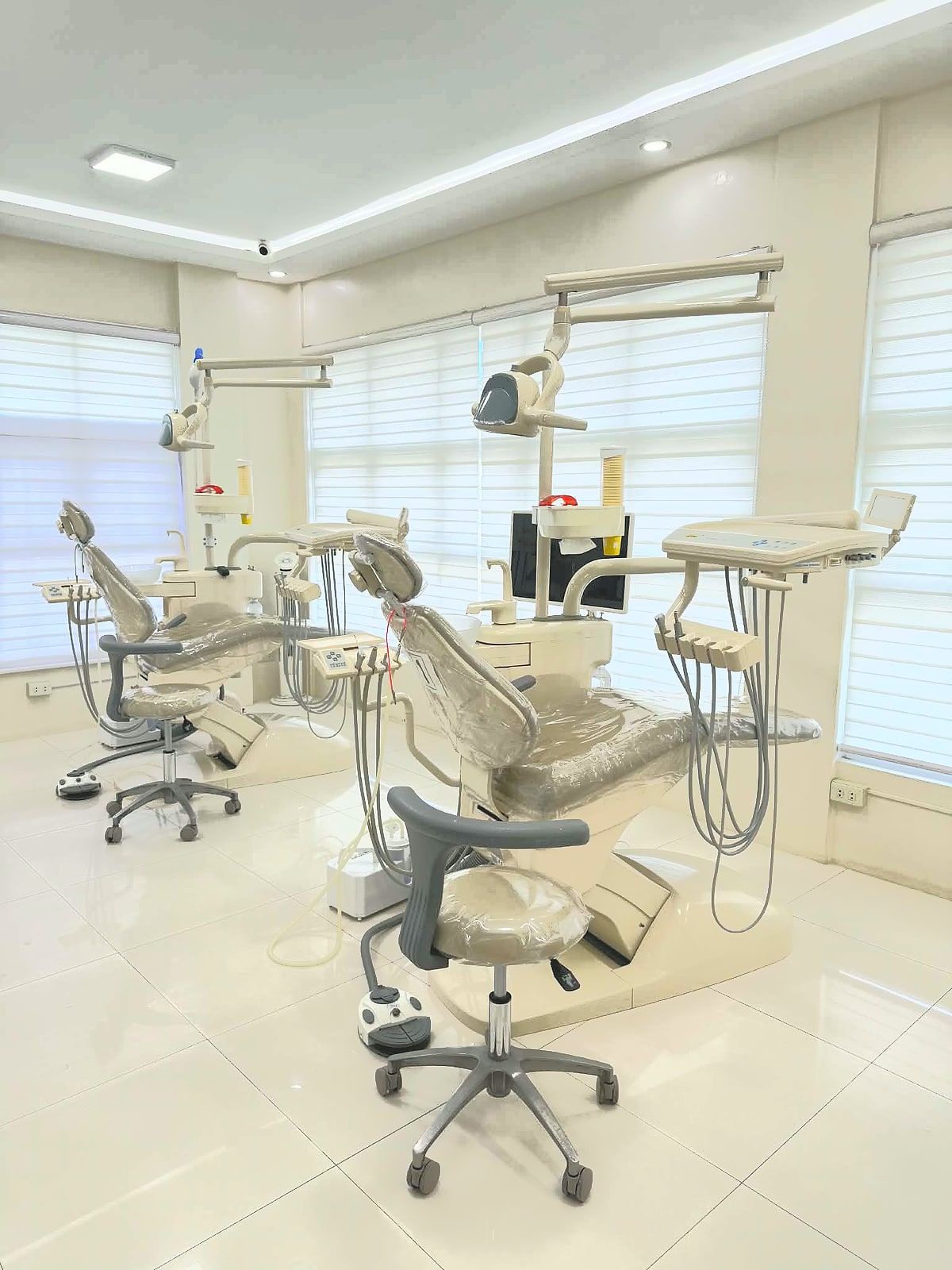 Bright treatment room with two dental chairs by the windows at the Citismiles clinic in Arayat, Pampanga